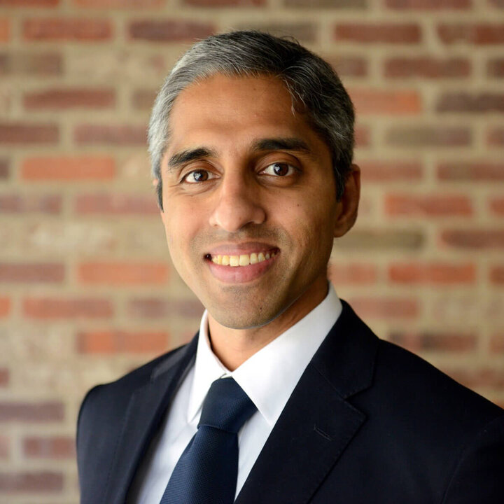 Dr. Vivek Murthy portrait in front of brick wall